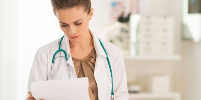 doctor examines tests for diagnosis of papillomavirus